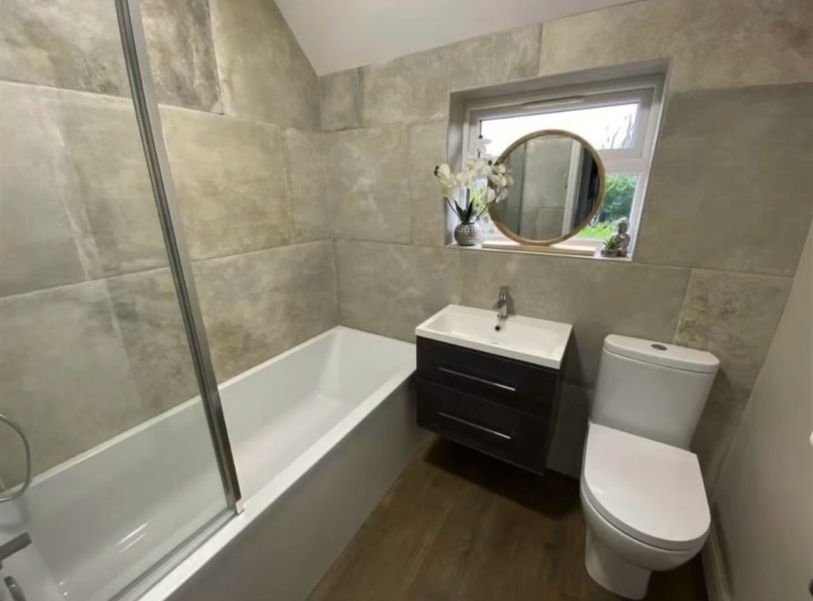 Contemporary green tiled shower room